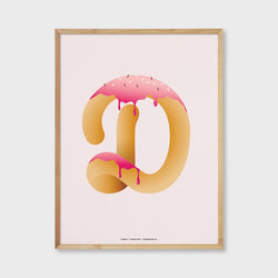 frosted pink letter D in the shape of a donut